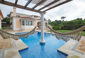 Noble beach villa with private garden and pool